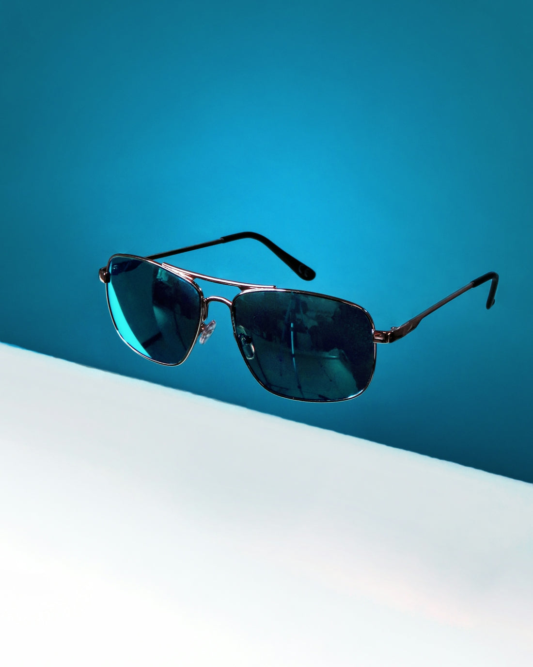 black framed aviator style sunglasses