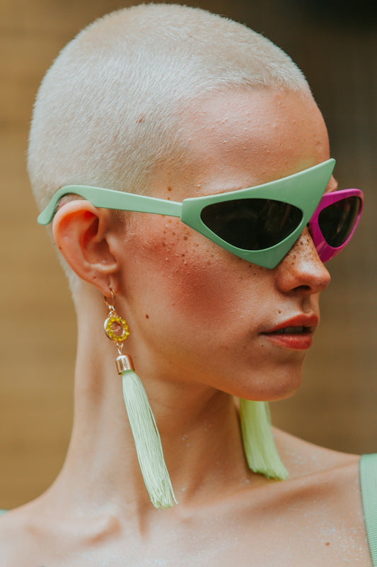 a close up of a person wearing sunglasses