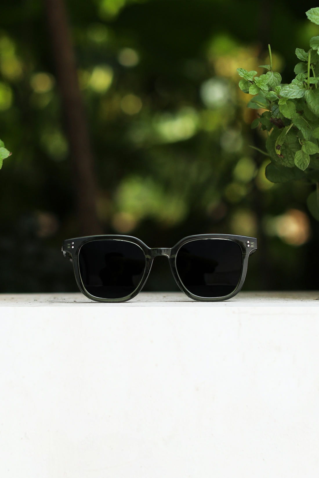 a pair of sunglasses sitting on top of a table