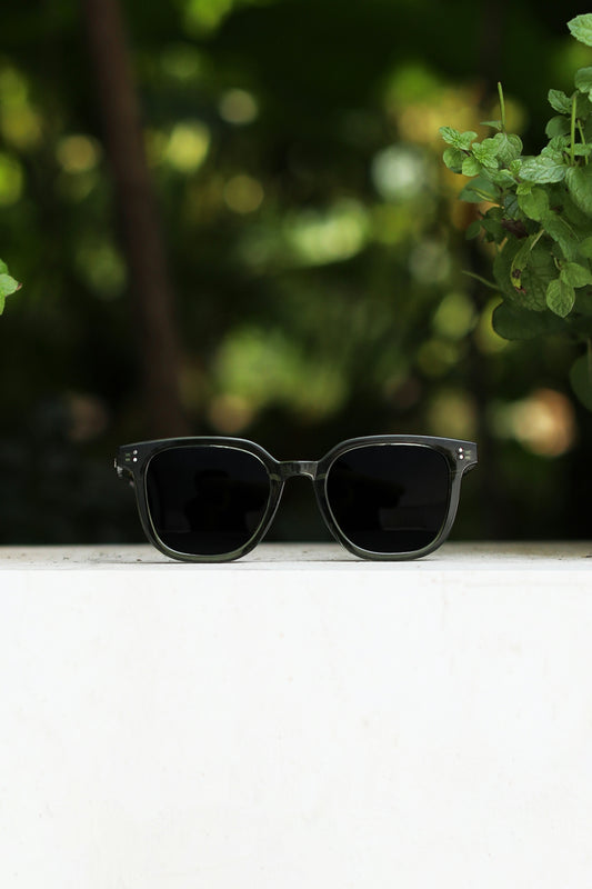 a pair of sunglasses sitting on top of a table