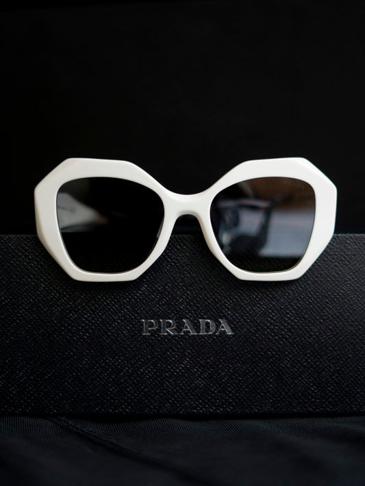 A pair of sunglasses sitting on top of a book